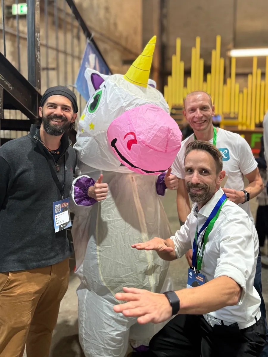 Good vibes at the booth at the AustrianStartups Summit, with a unicorn