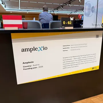 Booth 0–62 with the Amplexio sign, an Austrian flag and a description of the Relationship Operating System